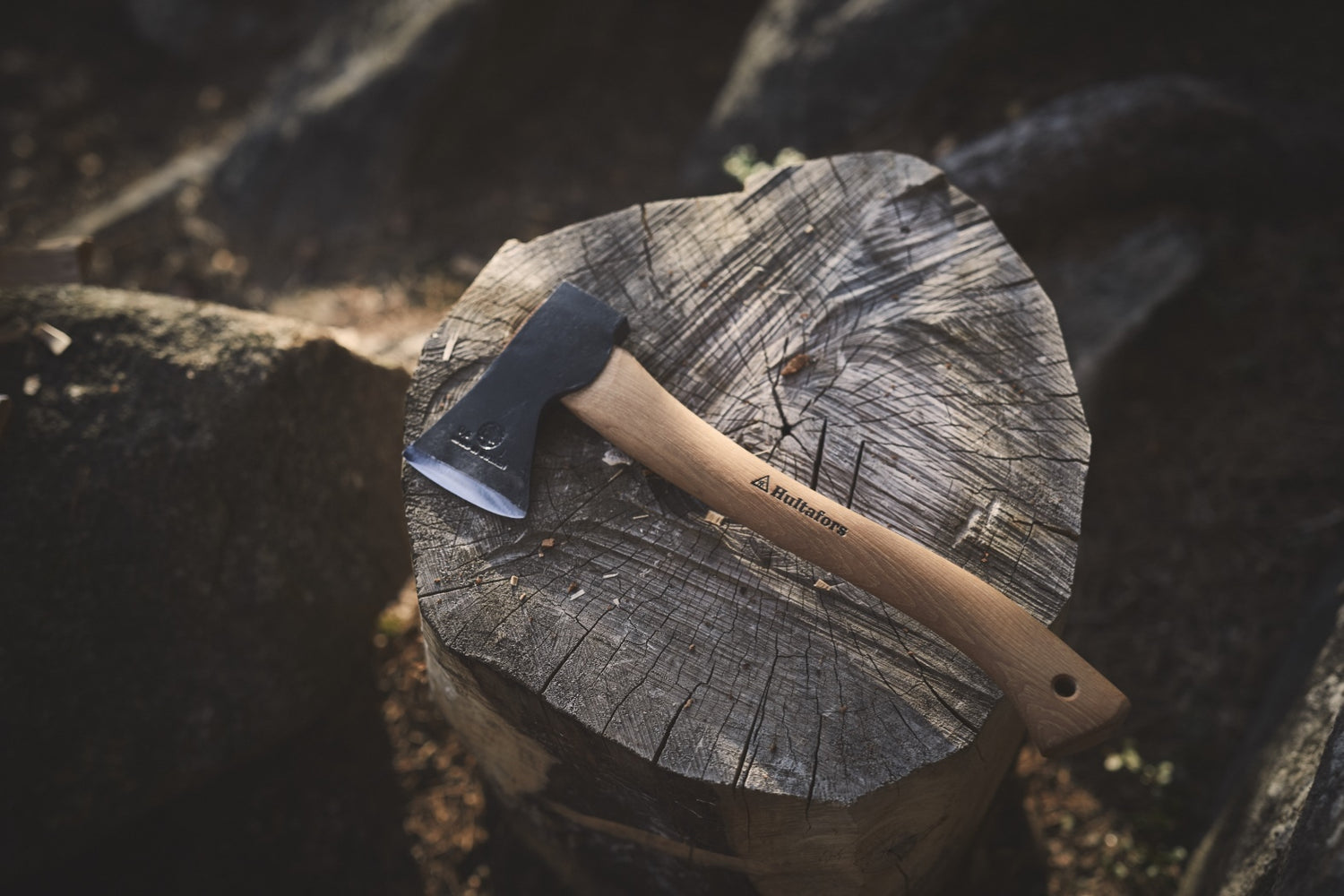 A Hultafors axe resting on a tree stump