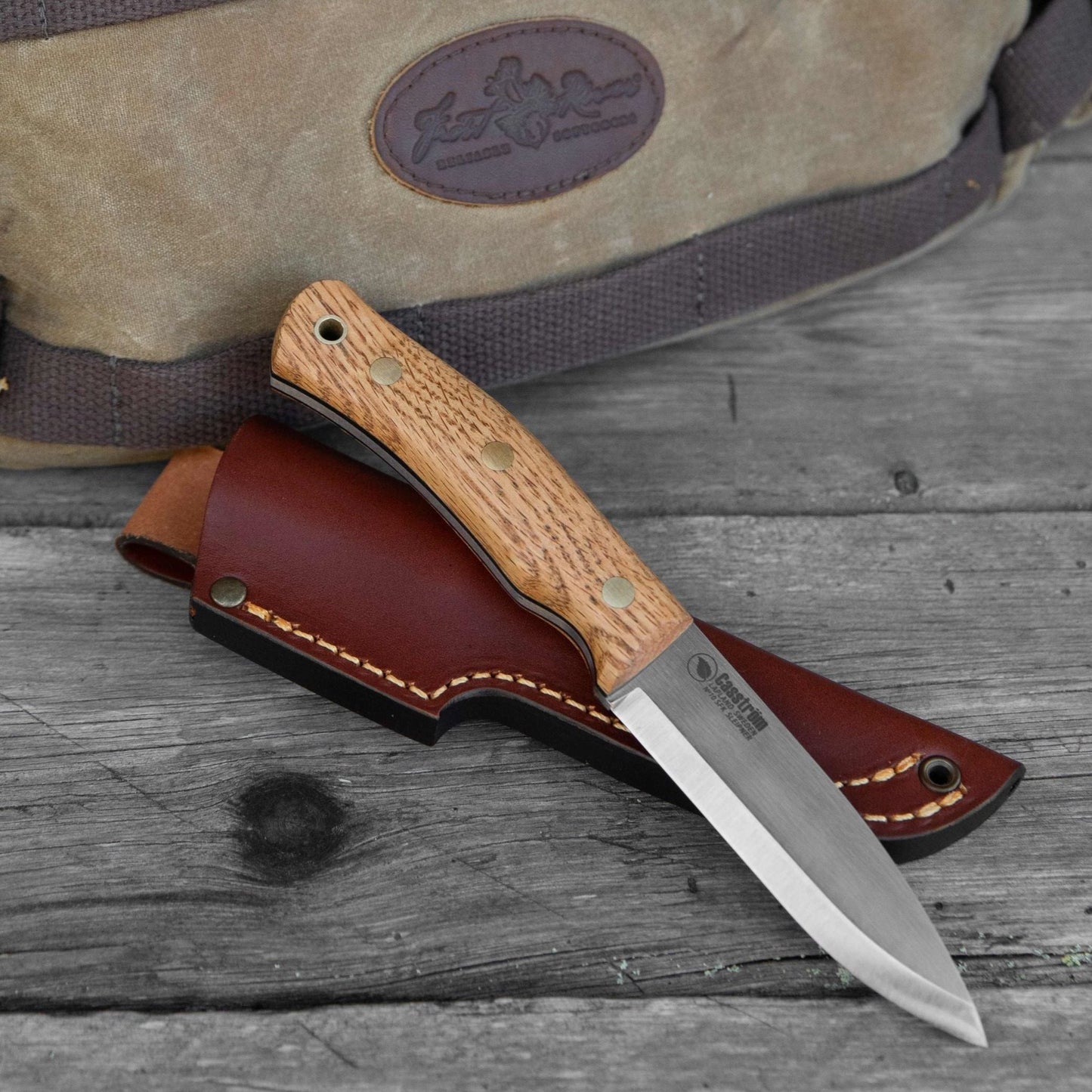 Casström No.10 knife with oak handle presented with a Frost River pack in the background.