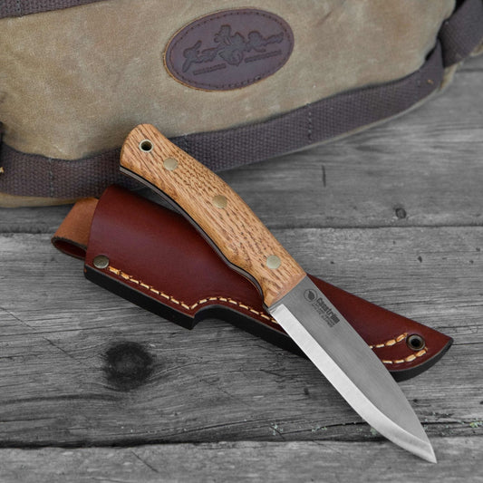 Casström No.10 knife with oak handle presented with a Frost River pack in the background.