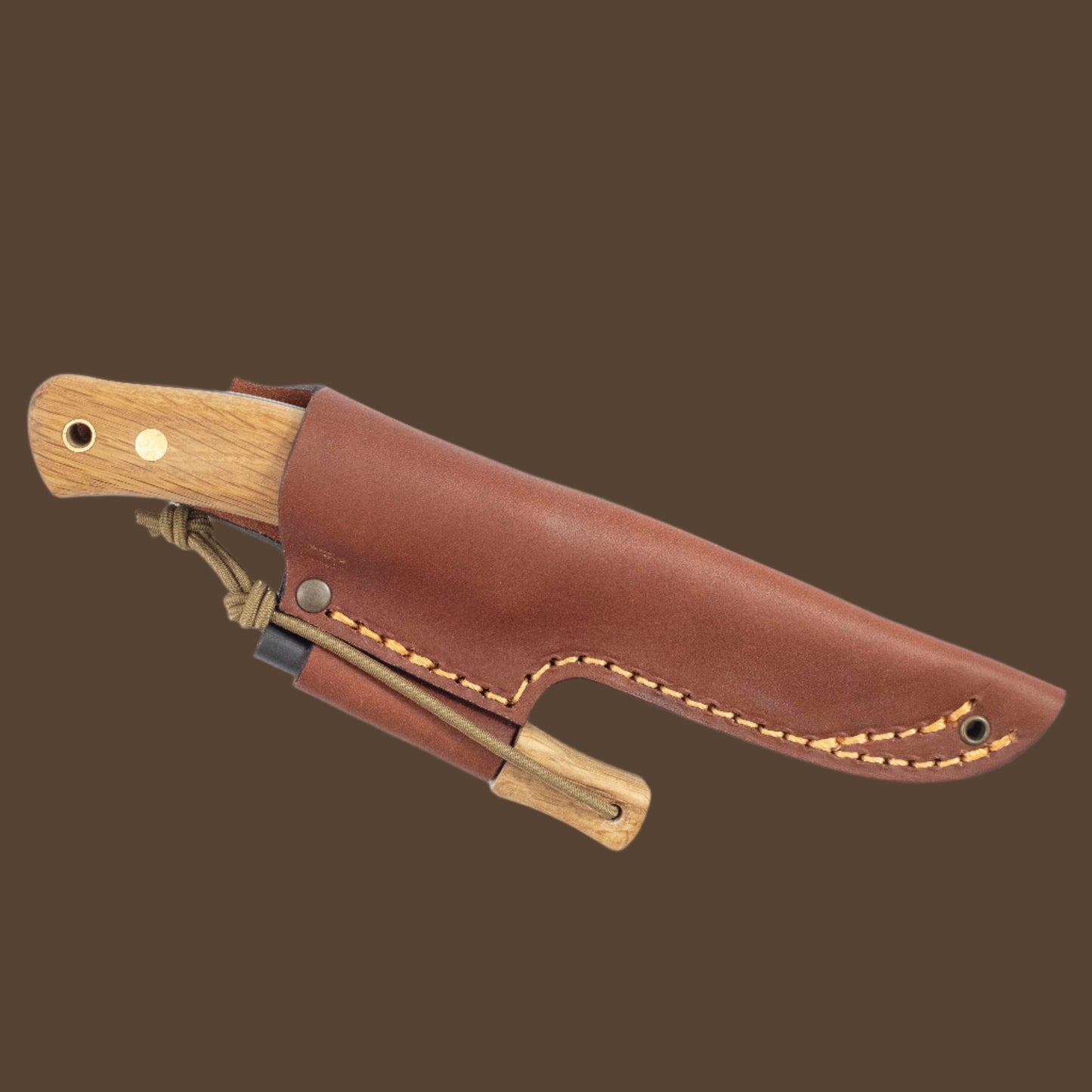 Casström No.10 knife with oak handle and matching firesteel, sheathed in a vegetable-tanned leather sheath.