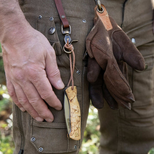 Casström Lock Back pocket knife attached to a Casström leather clasp lanyard.