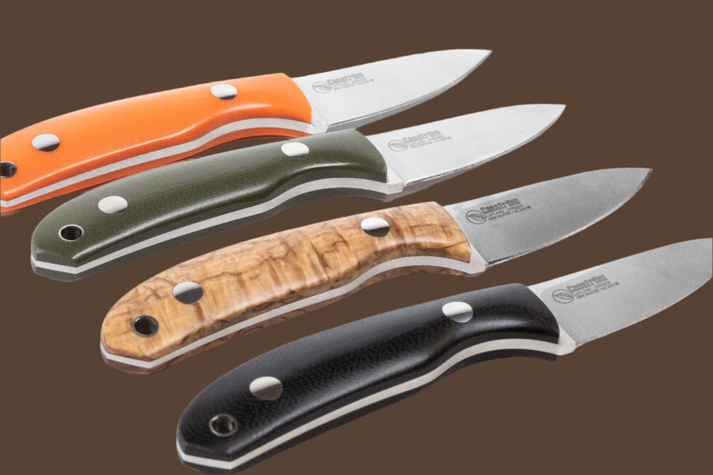 Casström Safari Knife model showing the range of handle colours - orange, olive green, curly birch, and black.