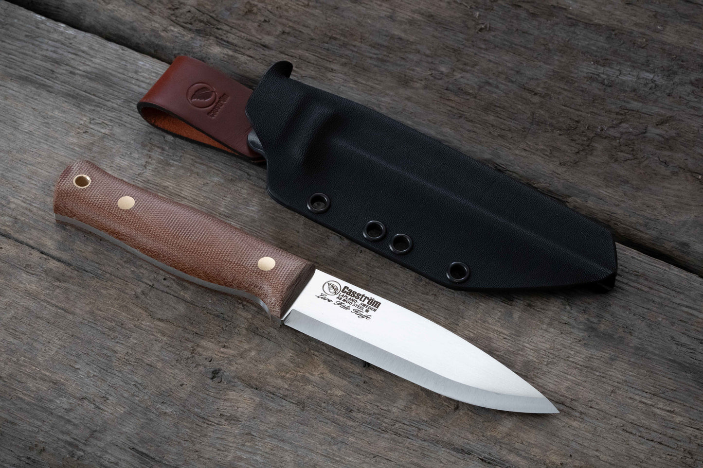 Casström Lars Fält Bushcraft knife close up - showing full length of knife, canvas micarta handle, and Kydex sheath