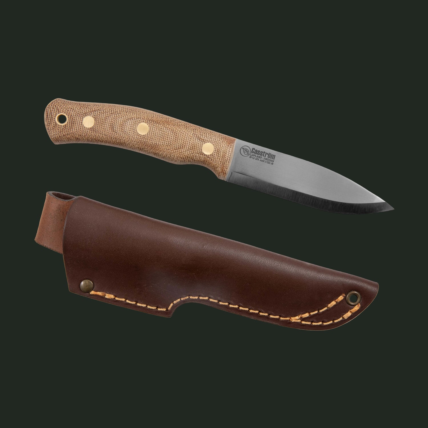 Casström No.10 SFK Canvas Micarta edition with hot-waxed leather sheath displayed in a studio product photograph.