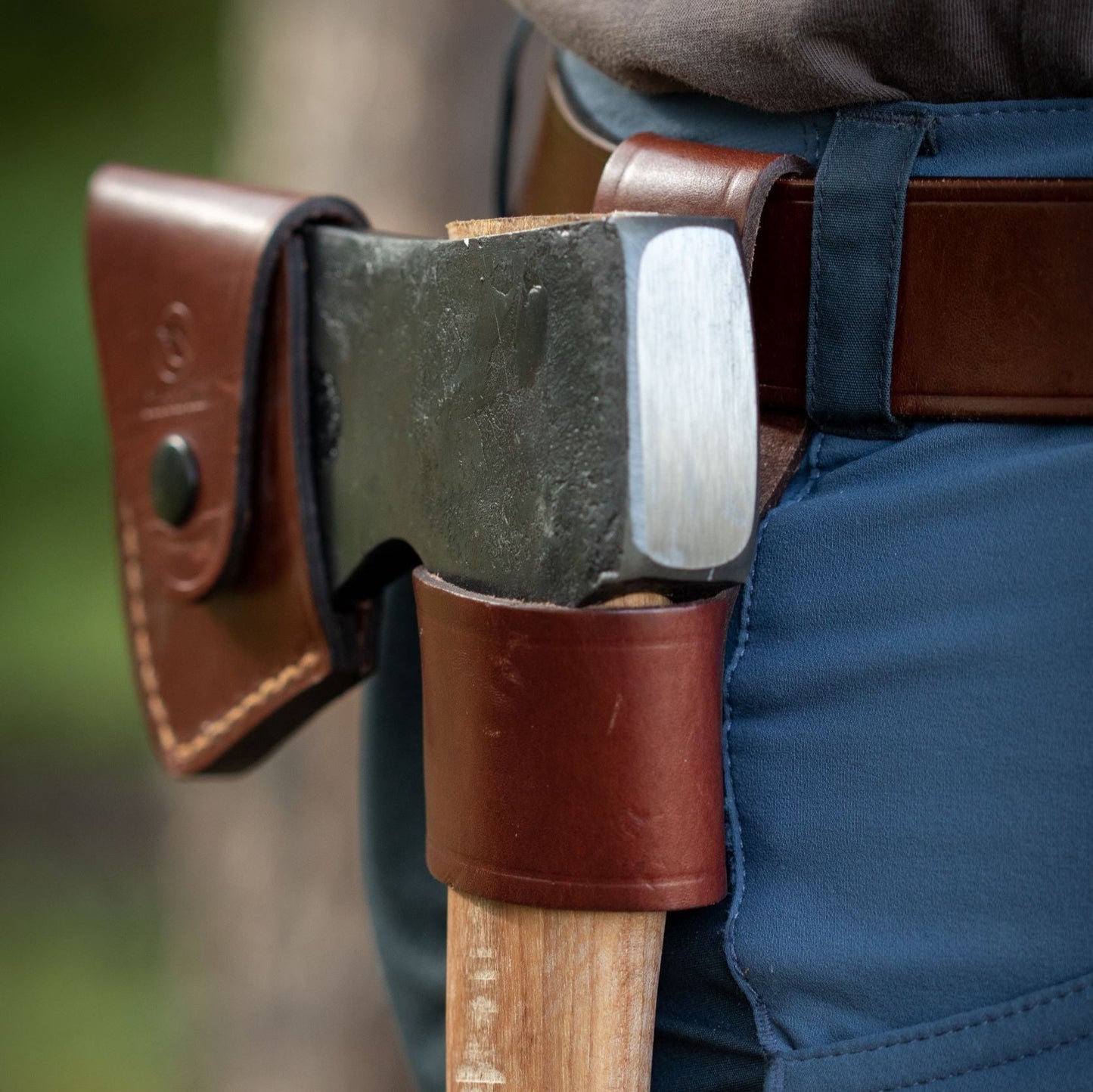 Casström leather axe loop, shown with axe on the belt.