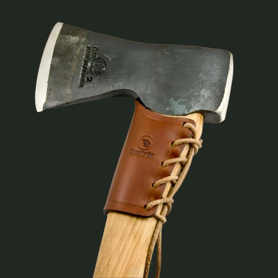 Studio image of the Casström leather overstrike guard designed to protect axe handles from damage during outdoor use.