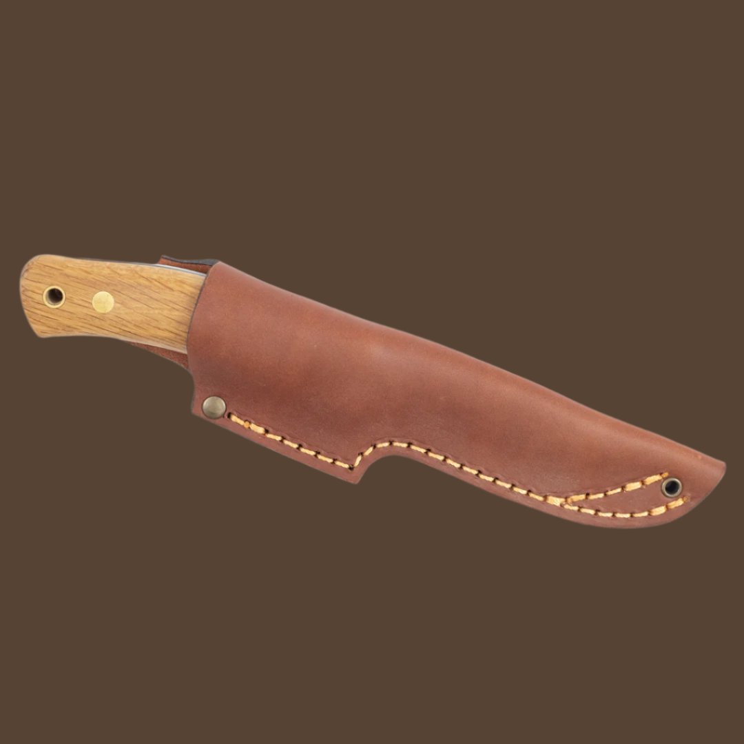 Casstrom No.10 Swedish Forest Knife, with oak handle. Knife is in a cognac brown leather sheath