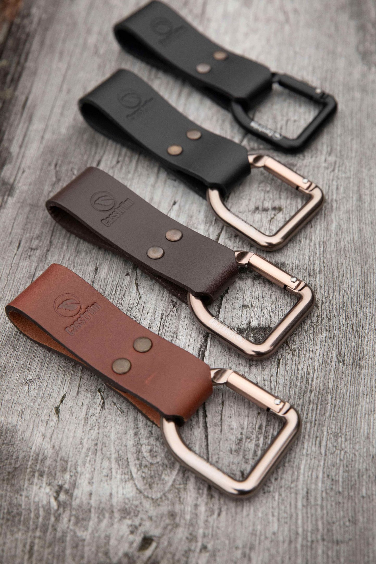 Casström No.3 Dangler models - cognac brown, dark brown, black, and black with black d-ring.