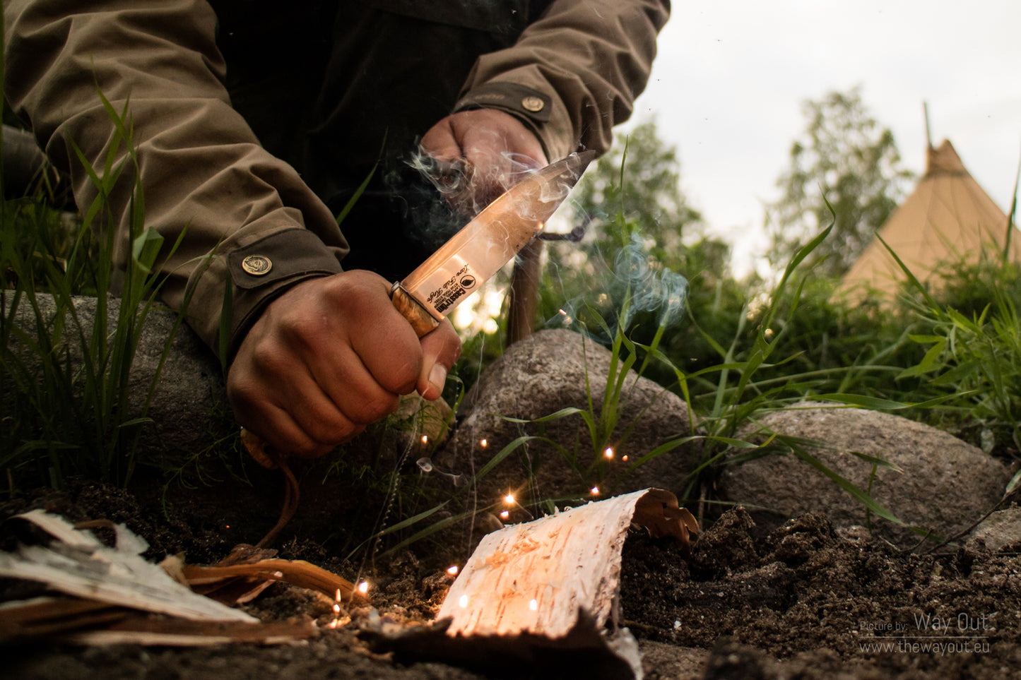 Using a Casström fire steel and Lars Fält knife to create sparks for making a fire