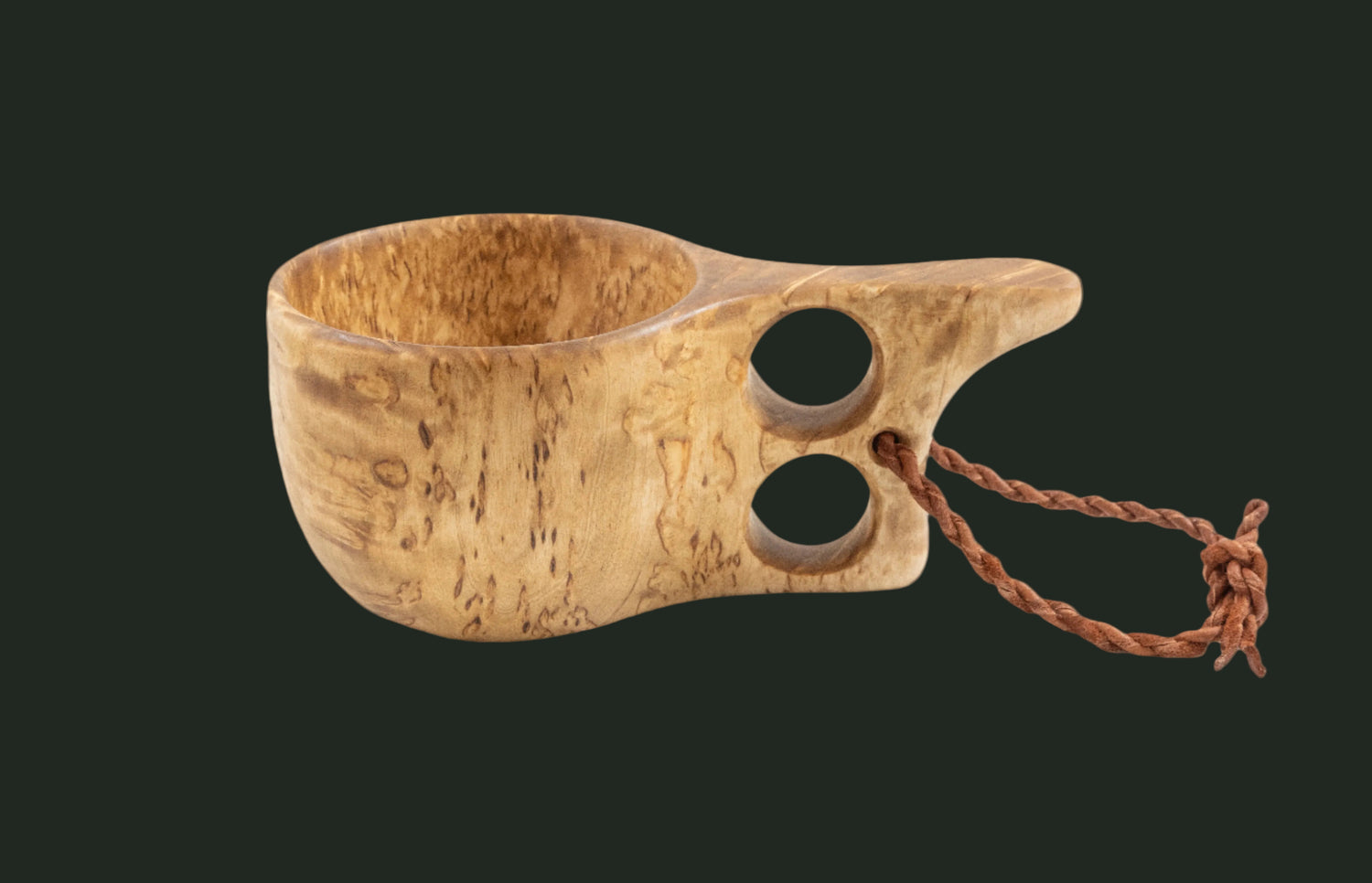 Hand-carved curly birch kuksa cup side profile on white background