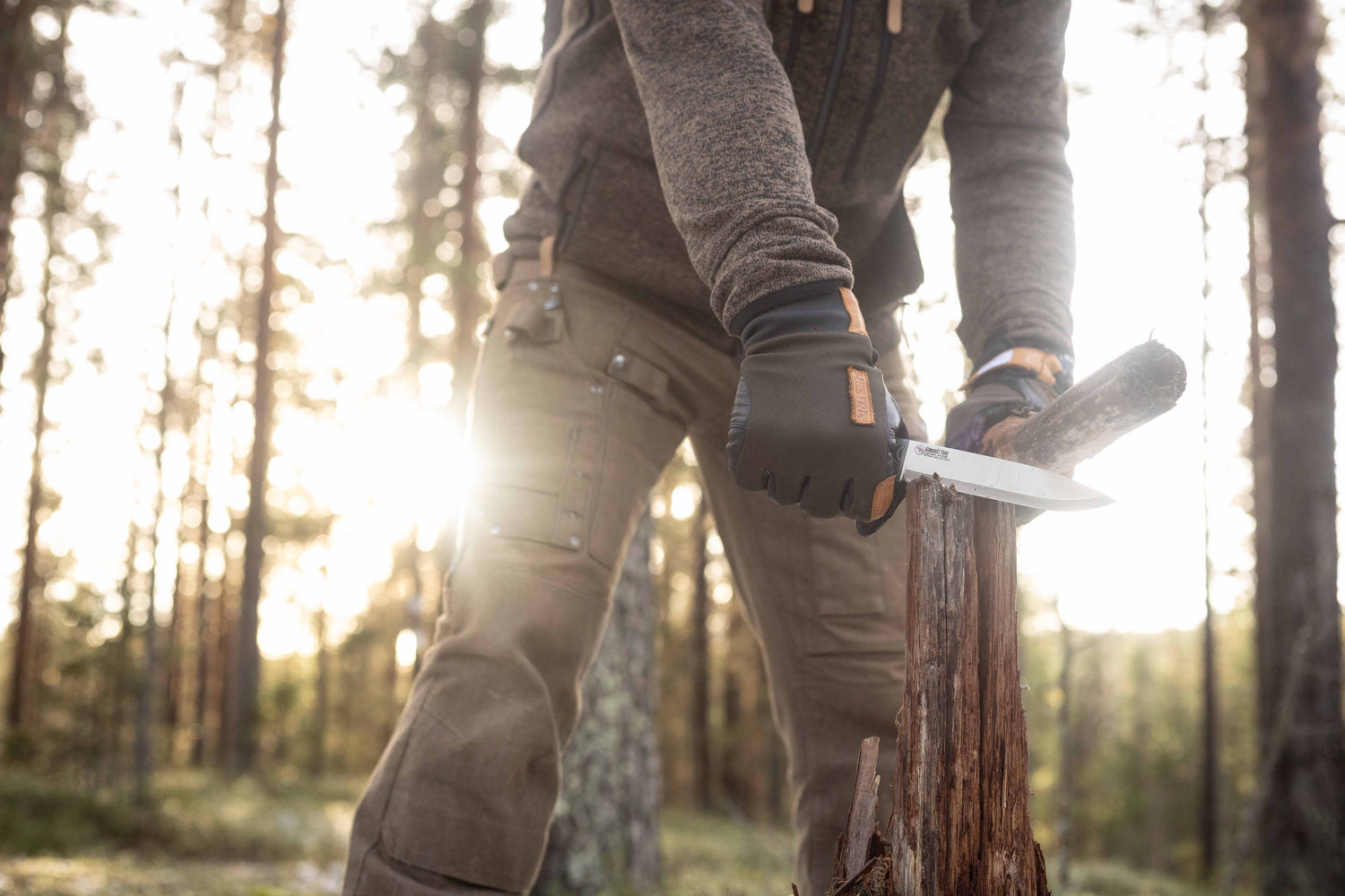 Casström No.14 Swedish Forest Knife batoning wood during bushcraft use in an outdoor woodland setting.