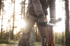 Casström No.14 Swedish Forest Knife batoning wood during bushcraft use in an outdoor woodland setting.