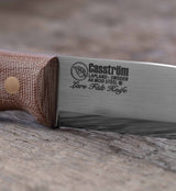 Close-up of the Casström Lars Fält knife with canvas micarta handle.