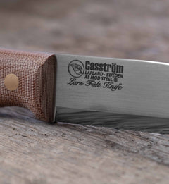 Close-up of the Casström Lars Fält knife with canvas micarta handle.