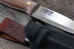 Close-up of the Casström Lars Fält knife with canvas micarta handle, A8 Mod steel blade, and a kydex sheath.