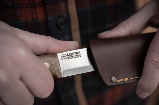 Casström No.10 Canvas Micarta - being drawn from the leather sheath