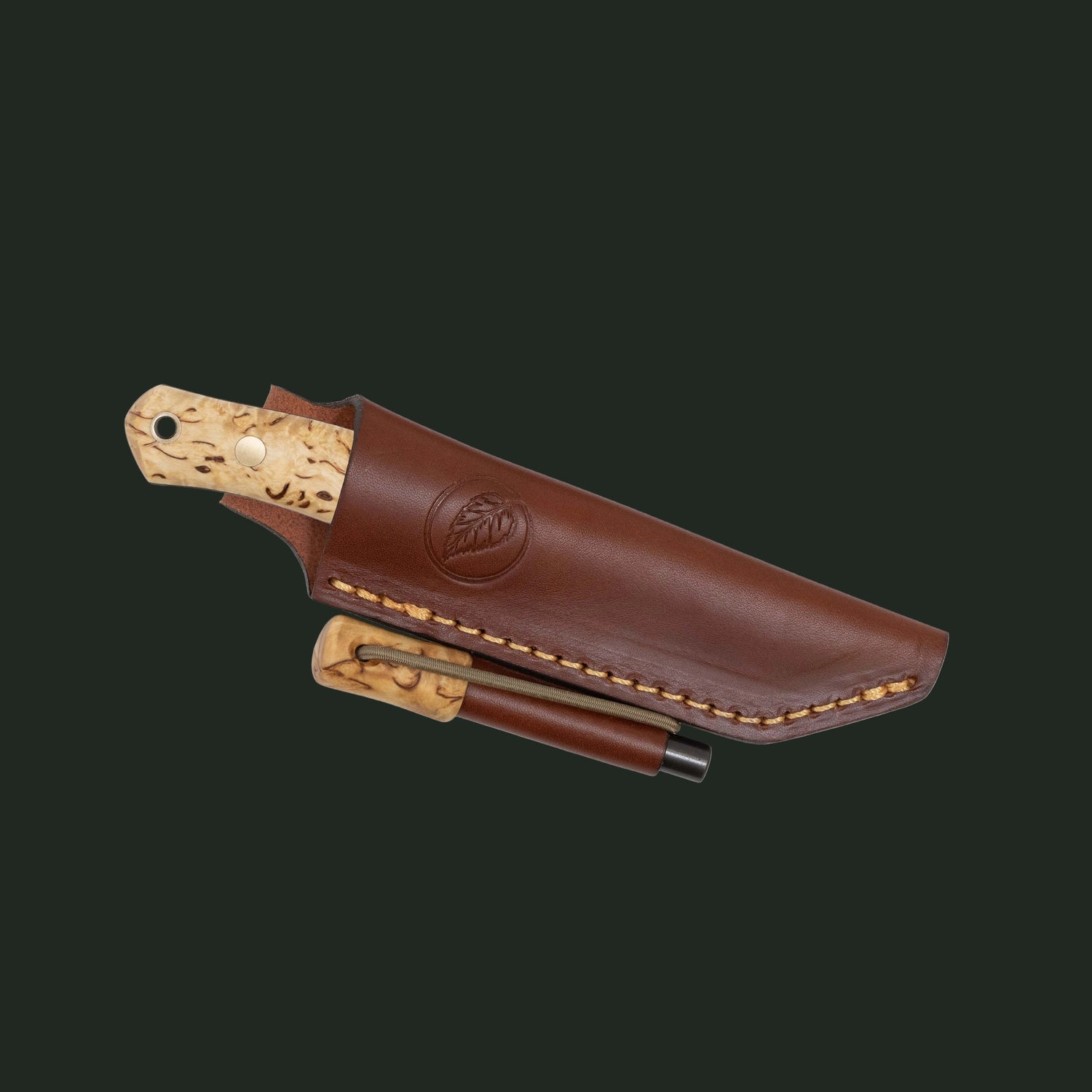 Casström No.8 SFK knife with curly birch handle, matching firesteel, and leather sheath on a white background