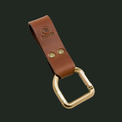Casström No.3 leather dangler with brass D-ring in cognac brown on white background