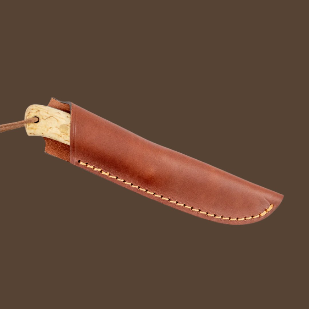 The Casstrom Woodsman survival knife in a sheath of ethically sourced European leather