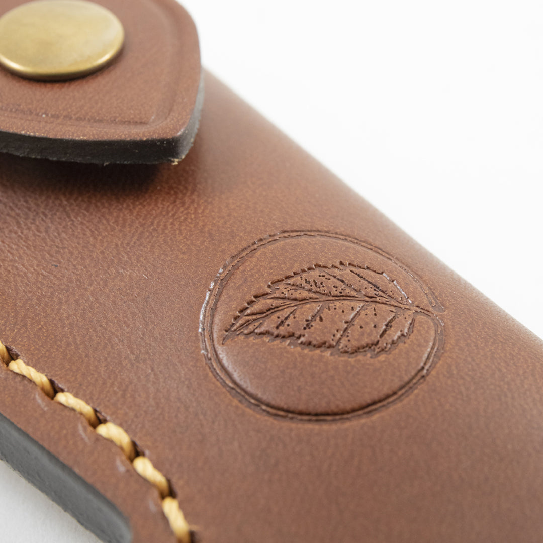 Close up of the Casström leaf logo on the Lars Fält folding knife pouch