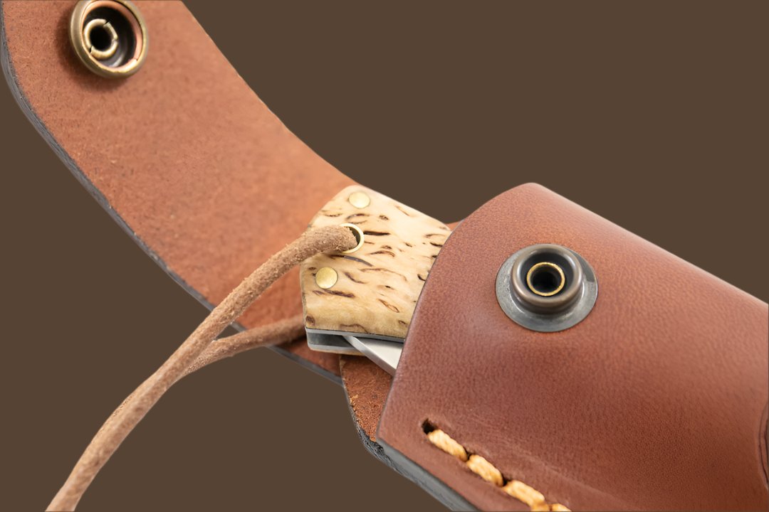 Press stud fastener for easy access on the Casström leather folding knife pouch.