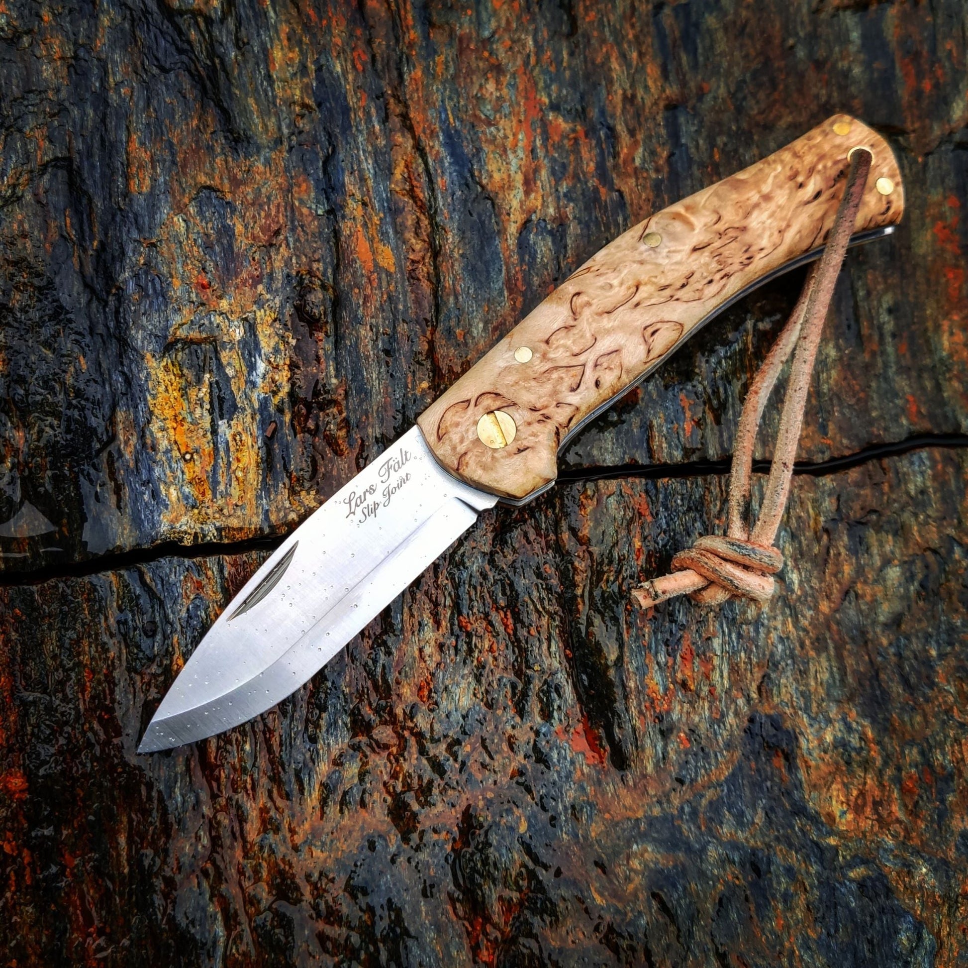 UK-legal folding knife, stainless steel blade, curly birch handle,, made by Casstrom Sweden. 