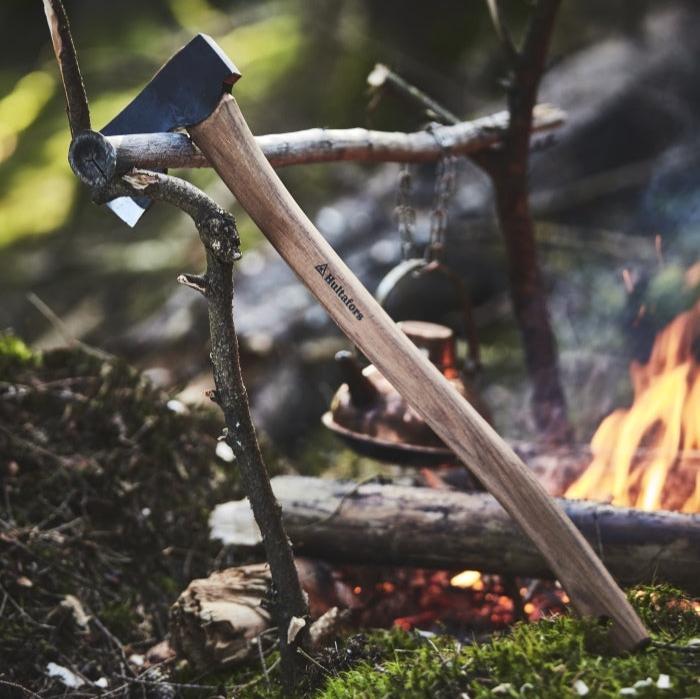 Lifestyle image of Hultafors Forest Axe next to a campfire